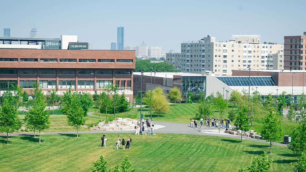 UMass Boston campus with Boston skyline in the background.
