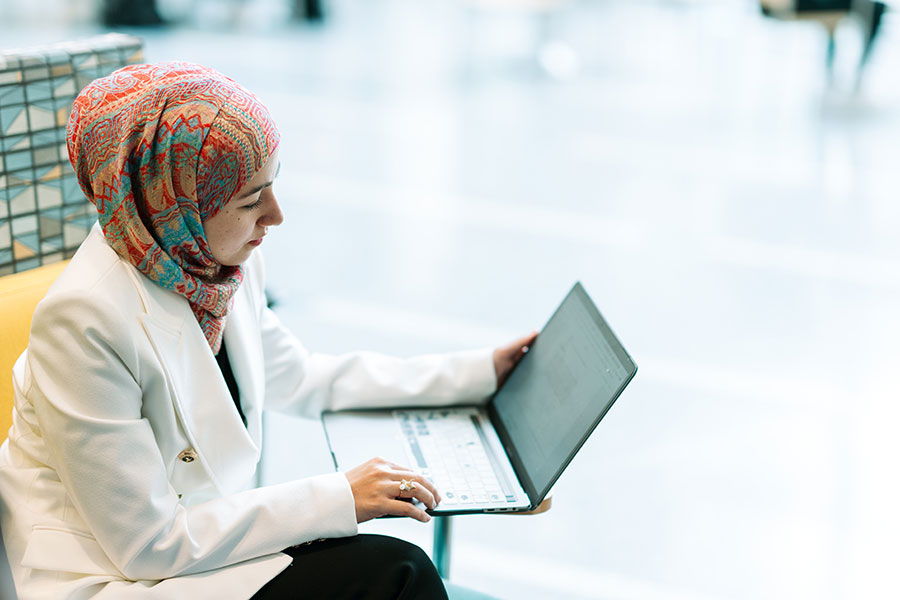 Management student using a laptop