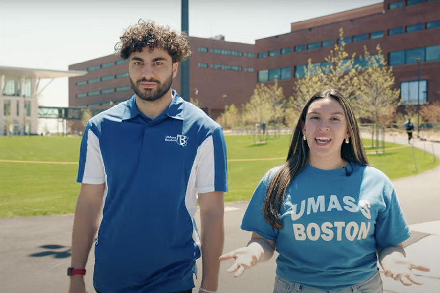 UMass Boston Students Abdul and Isabella stand on the Quad introducing the video tour