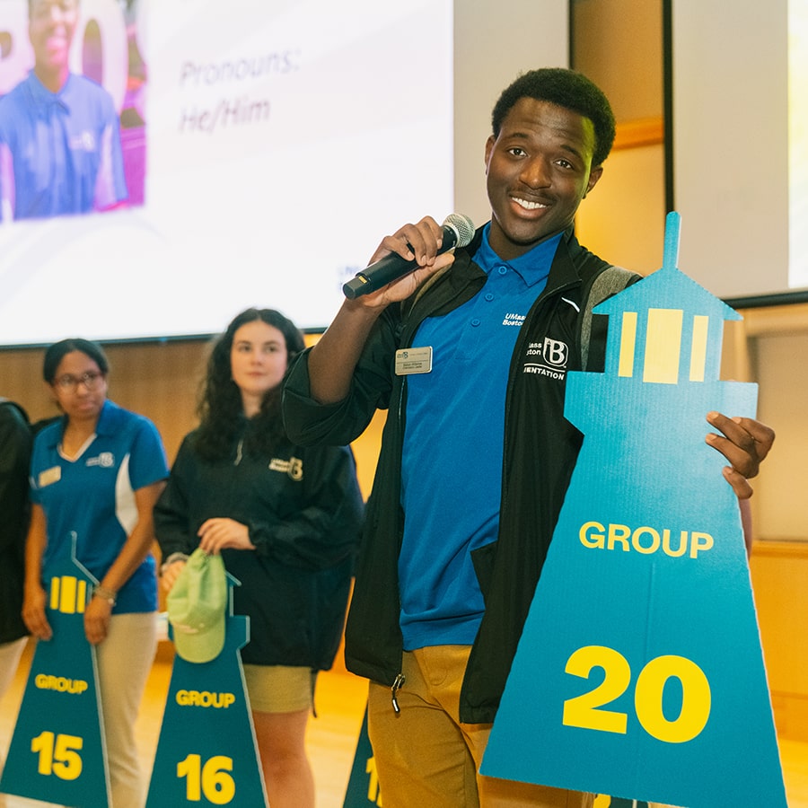 Beacon Ambassadors holding sign during Orientation