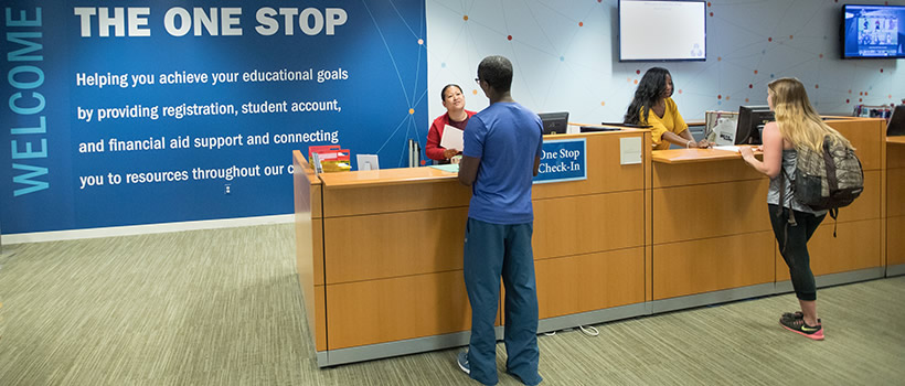 UMass Boston students check in at The One Stop, which provides financial aid, registrar, and the Bursar's Office answers in one location.