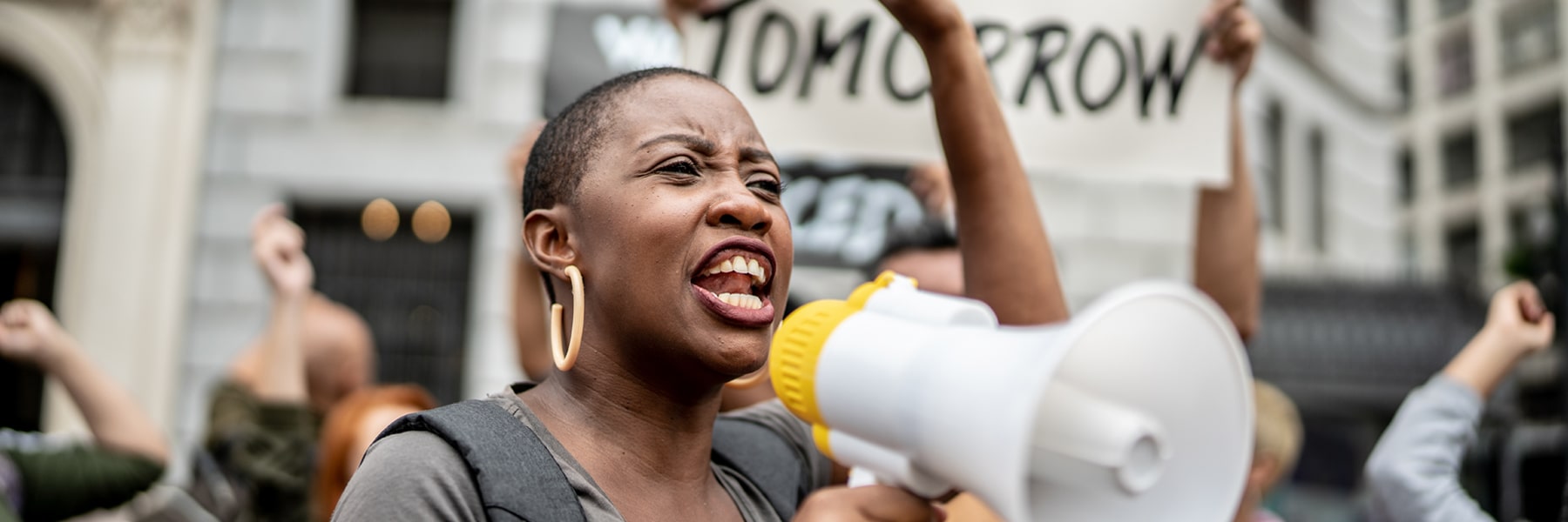 Black woman shouting into megaphone