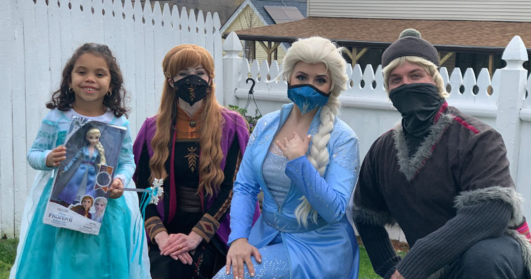 Characters from Frozen, wearing face masks, visit a child battling a serious illness.