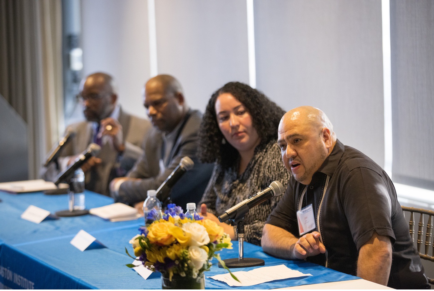 L to R: LLOP panel moderator Karl Bell, director of mentoring and academic achievement at Boston College, with panelists Carlos Maynard, Tariana Little, and Joel Mora.