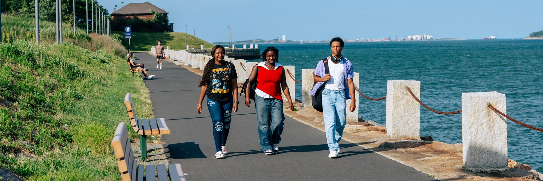 Students walk along Harbor Walk