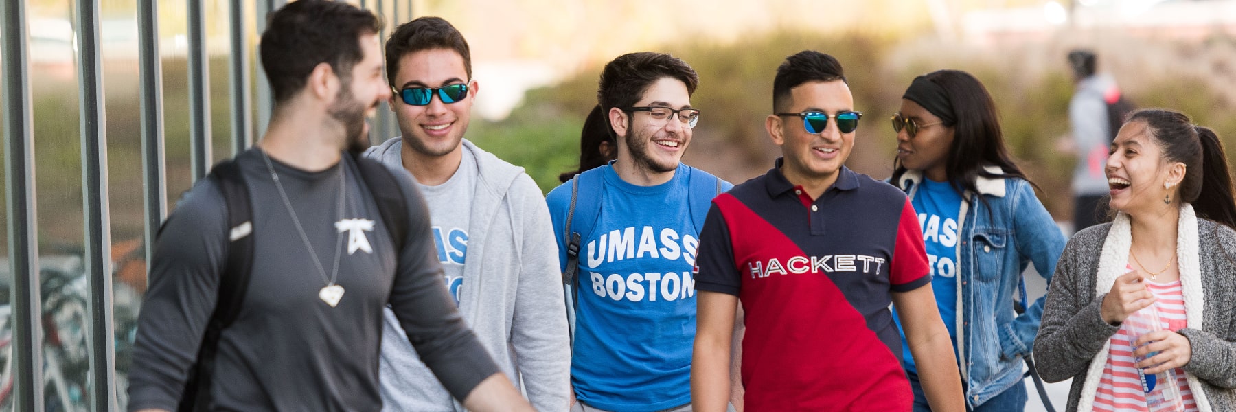 Group of diverse students walking laughing